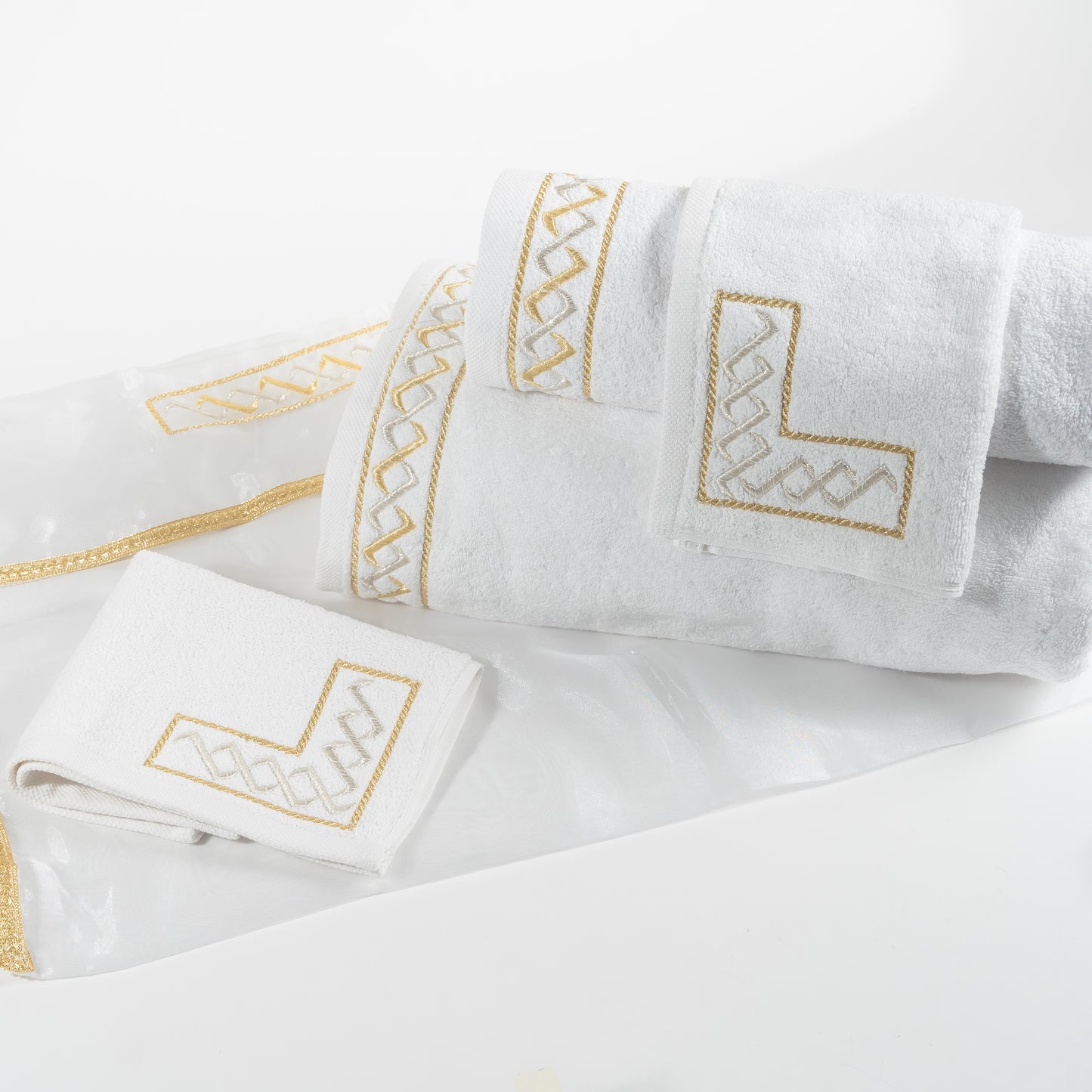 Pack de 4 serviettes brodées dans leur housse brodée 'Signature'
